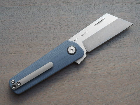 RUNTLY folding knife in open position. Color: smokey gray