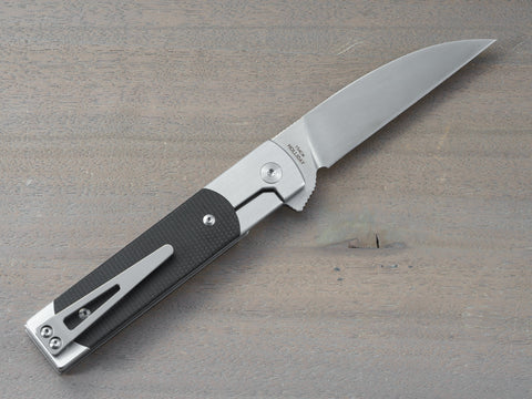 Holliday flipper knife with black linen micarta handle