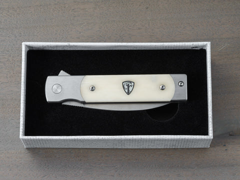 Holliday pocket knife with white handle