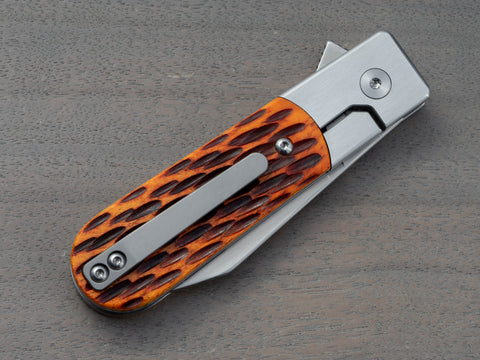 Titanium clip on a Model 1929 pocket knife with jigged bone handle