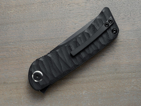 Black folding knife with clip