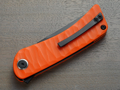 Orange folding knife with clip