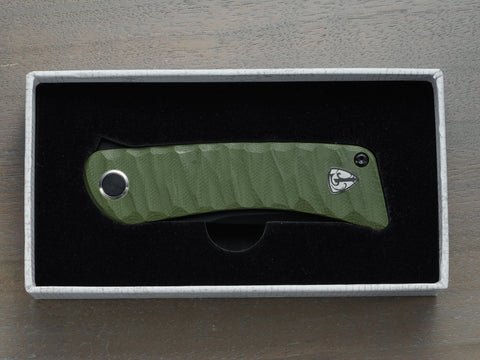 Green Tikuna pocket knife inside box