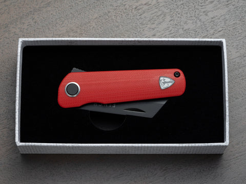 A red RUNTLY pocket knife in box